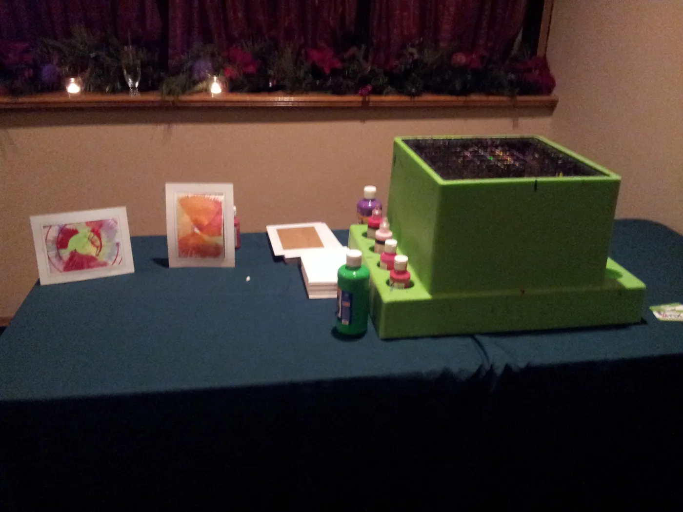 A spin art station with finished designs on display